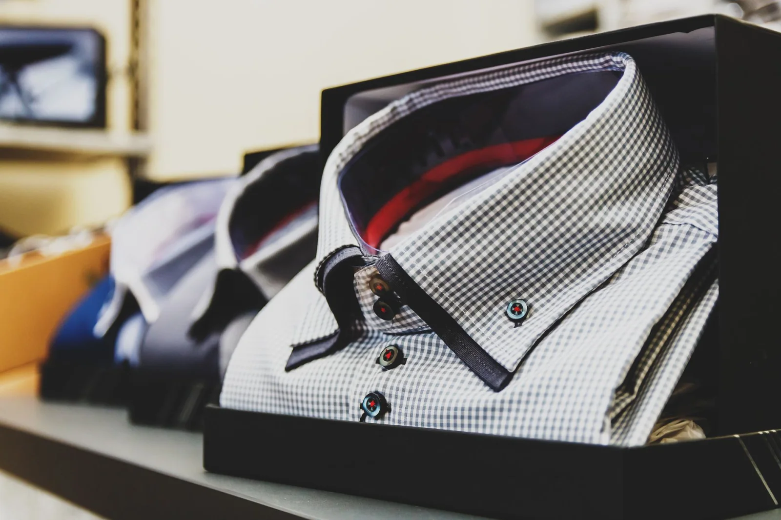 Formal checkered shirts neatly packed in boxes, ideal for business or gift.