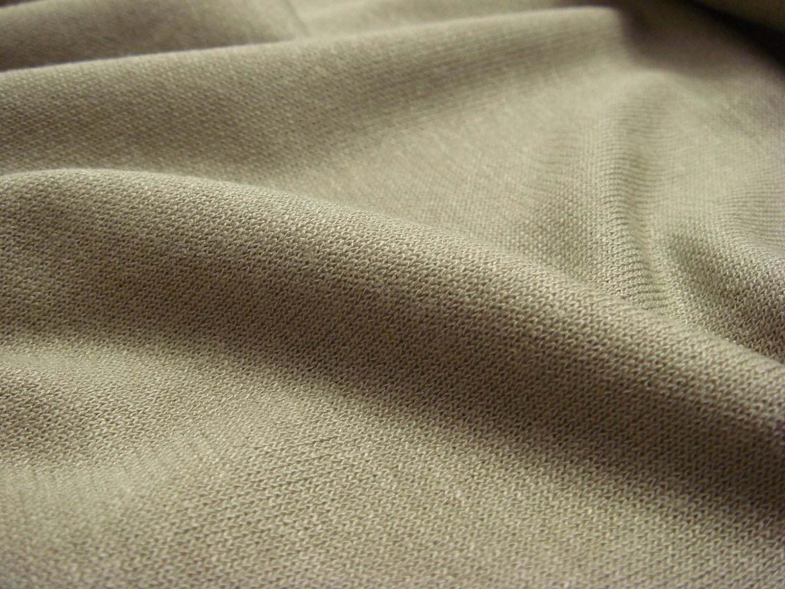 Close-up of interlock jersey fabric showing texture and distinctive loops of jersey knit.